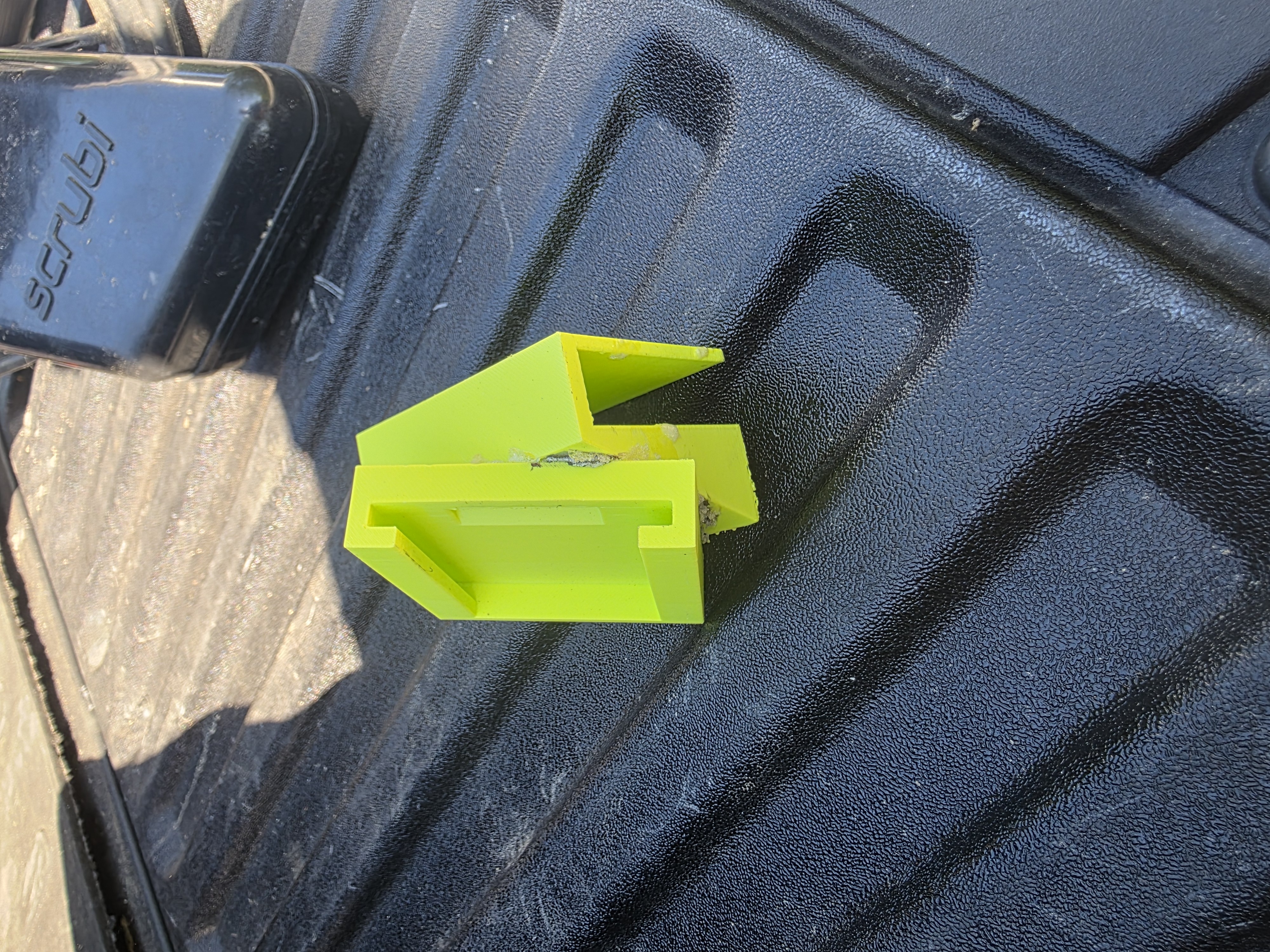 The upper bracket piece on its own. The slot and locking geometry are visible here.